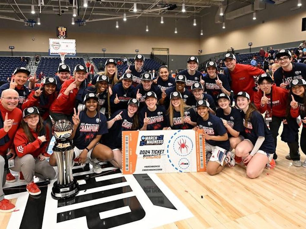 The Spiders celebrate their victory over the University of Rhode Island on March 10. Courtesy of Richmond Athletics.