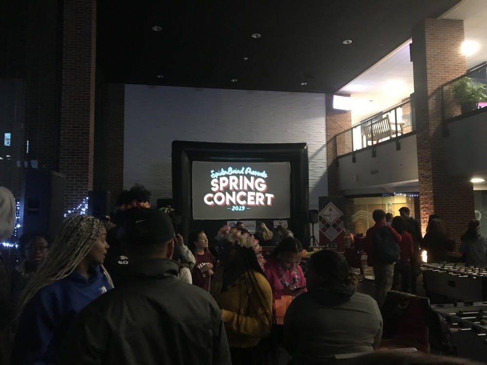 <p>Students at the spring concert reveal party hosted by SpiderBoard in the Current on Thursday, Feb. 28.</p>