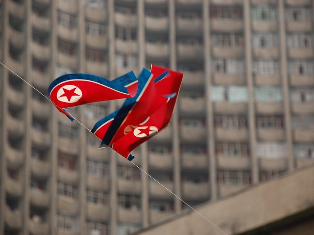 Flags wave in Pyongyang, North Korea. Courtesy of Creative Commons.