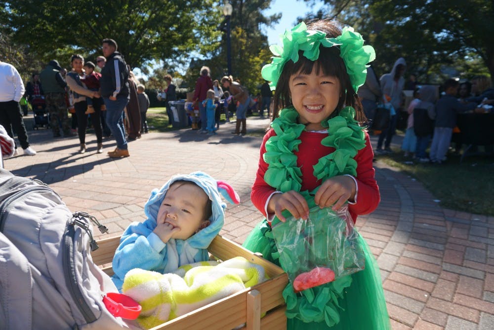 Children came to the event in costumes, like these two sisters dressed as Lilo (right) and Stitch.