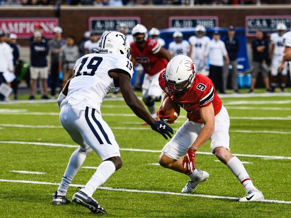 Graduate student wide receiver Charlie Fessler is blocked by Yale defense during a game at Robins Stadium on Saturday, October 19, 2019. 