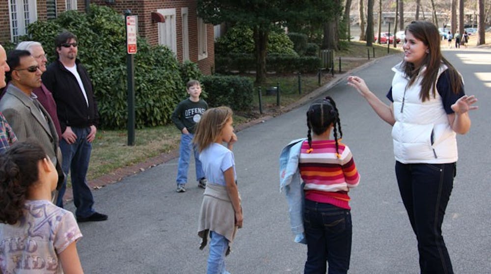 Caroline Vincent, '11, begins a tour around campus for the children
