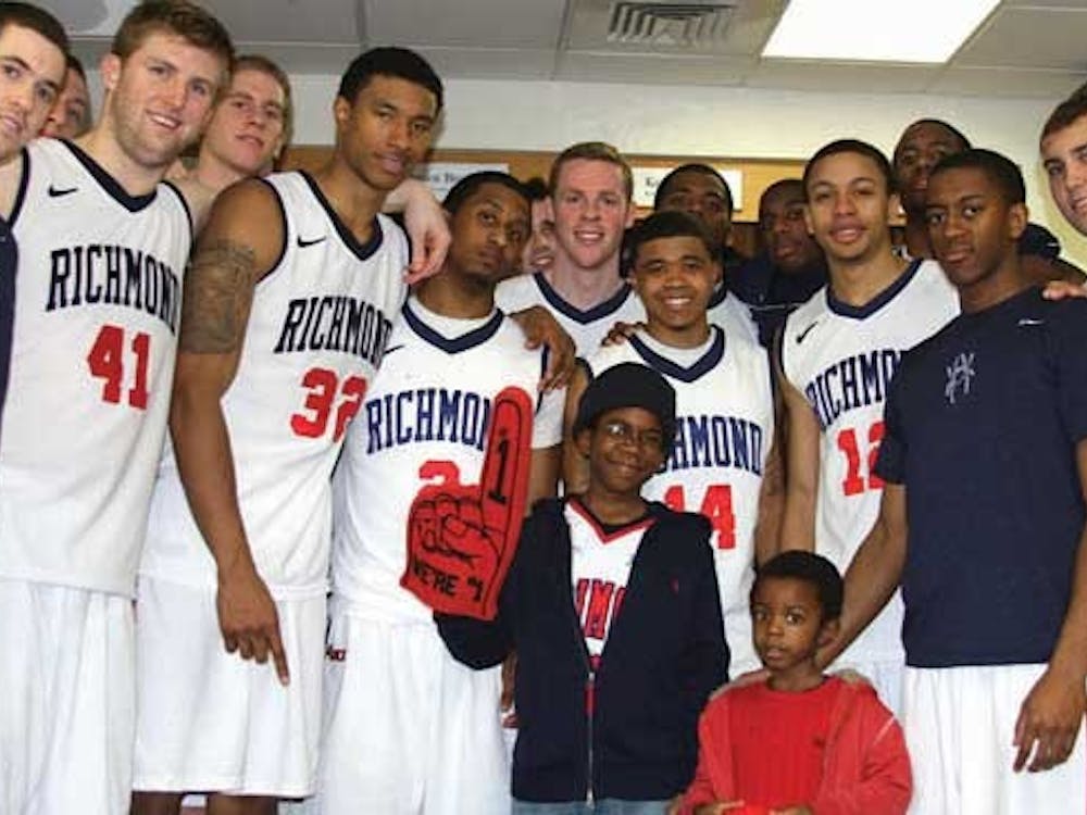Colleen Szurkowski fills out a voter registration form at a stand in the commons with the help of Amanda Kleintop. She is one of 375 students who have registered on campus. (Nikki Waterman/The Collegian)