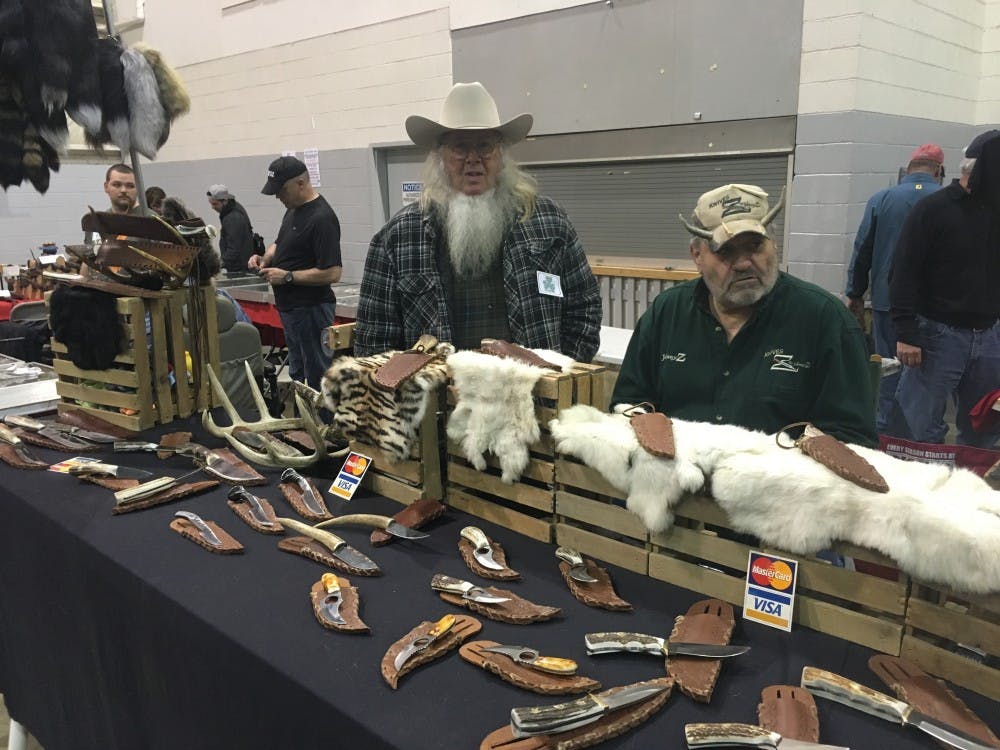 Johnny Z (right, antlers) selling Knives by Johnny Z