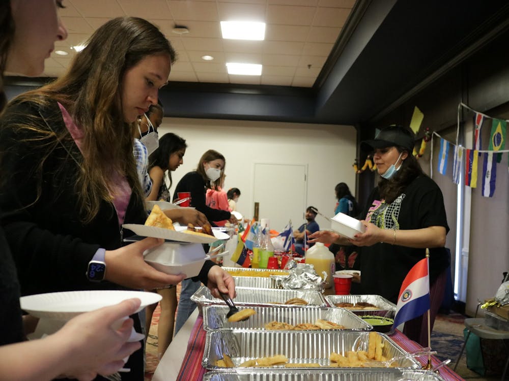 Students get food from the Solidarity Organization for Latinx Students table at "A Taste of the World" on April 16.