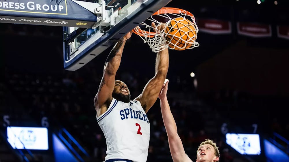 <p>Junior forward Jaden Daughtry gets a basket. Courtesy of Richmond Athletics</p>