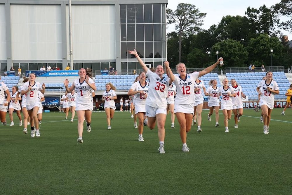 Spiders celebrate a victory over Marquette University n the first round of the NCAA Tournament at Dorrance Field in Chapel Hill, NC May 12.&nbsp;