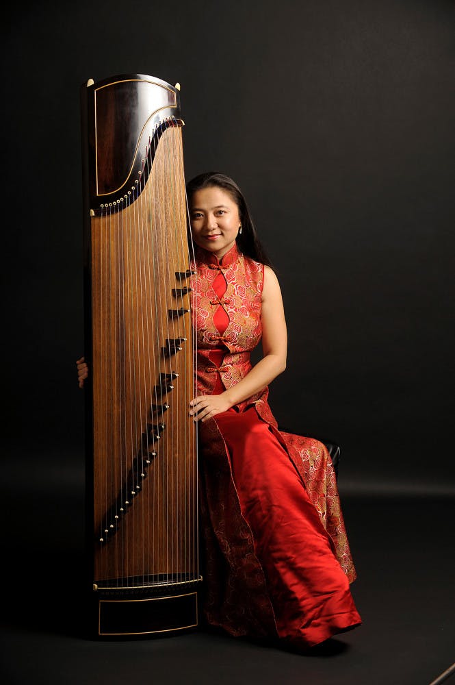 Listen to the art of guzheng, performed by Haiqiong Deng The Front