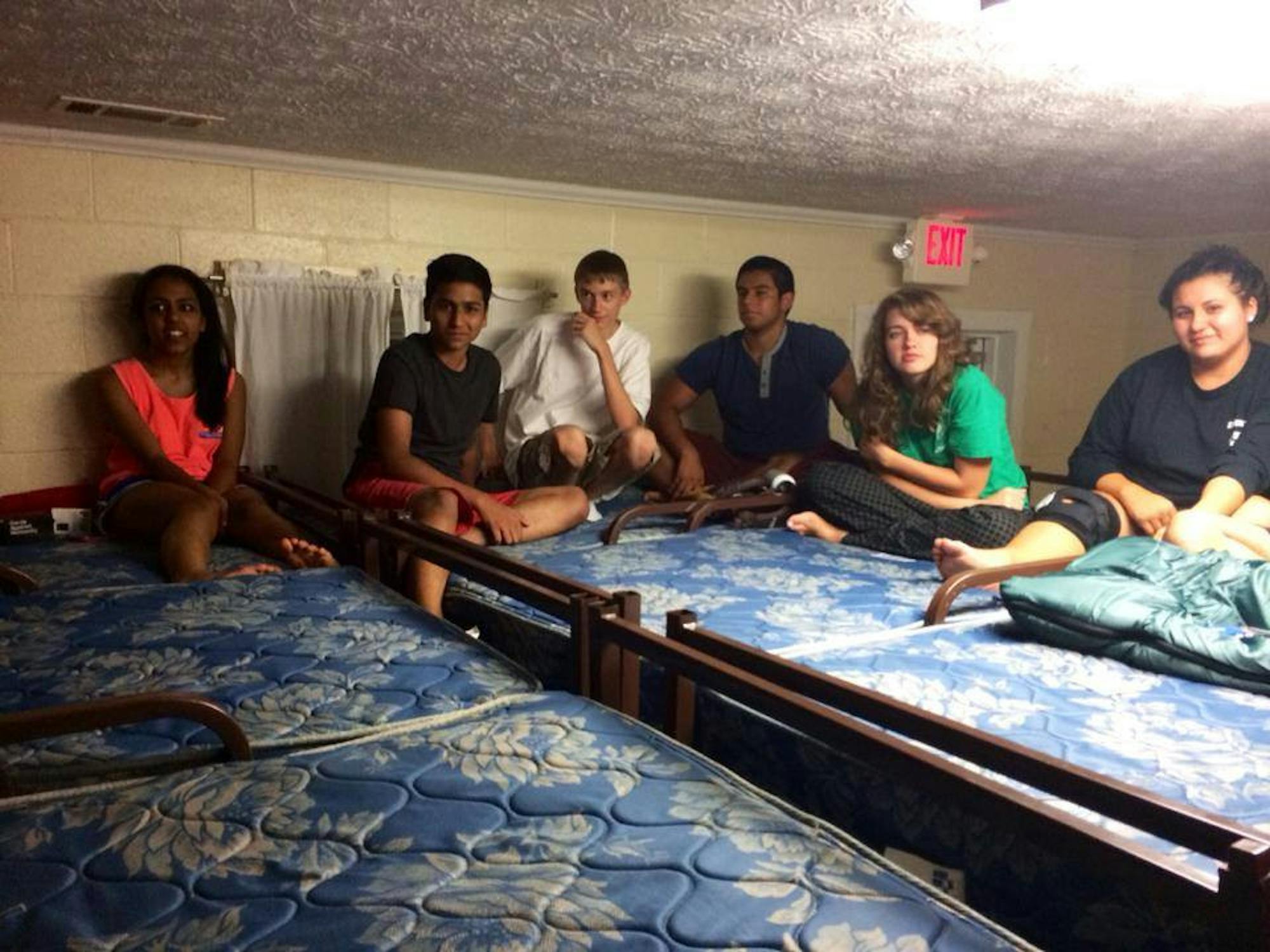 Alicia Johnson (right) and Faraaz Hossain (second from right) talk at the Fall 2014 Student Activities Committee retreat, where they met for the first time. / Courtesy of Alicia Johnson