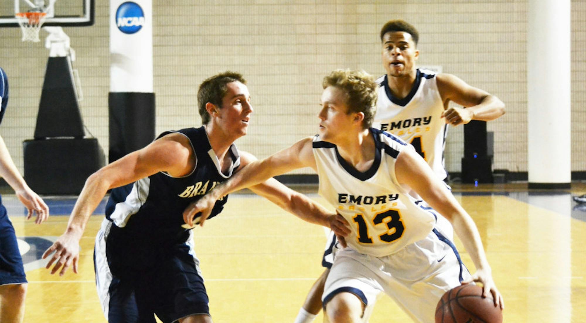 Freshman guard Whit Rapp defends against a Brandeis University (Mass.) player. Rapp and the Eagles defeated Brandeis 89-53 after also beating them last weekend on Jan. 30, while Emory was away. The Eagles also played and lost to New York University for the second weekend in a row. | Erin Baker/Staff