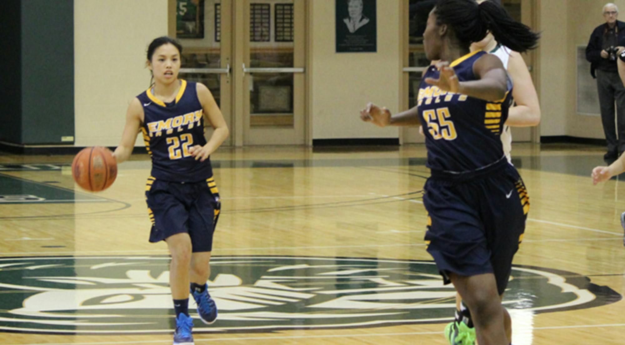 Junior guard Ilene Tsao Dribbles down the court behind freshman Dumebi Egbuna. Tsao, Egbuna and the Emory women will continue their conference play at home next week. | Courtesy of Emory Athletics.