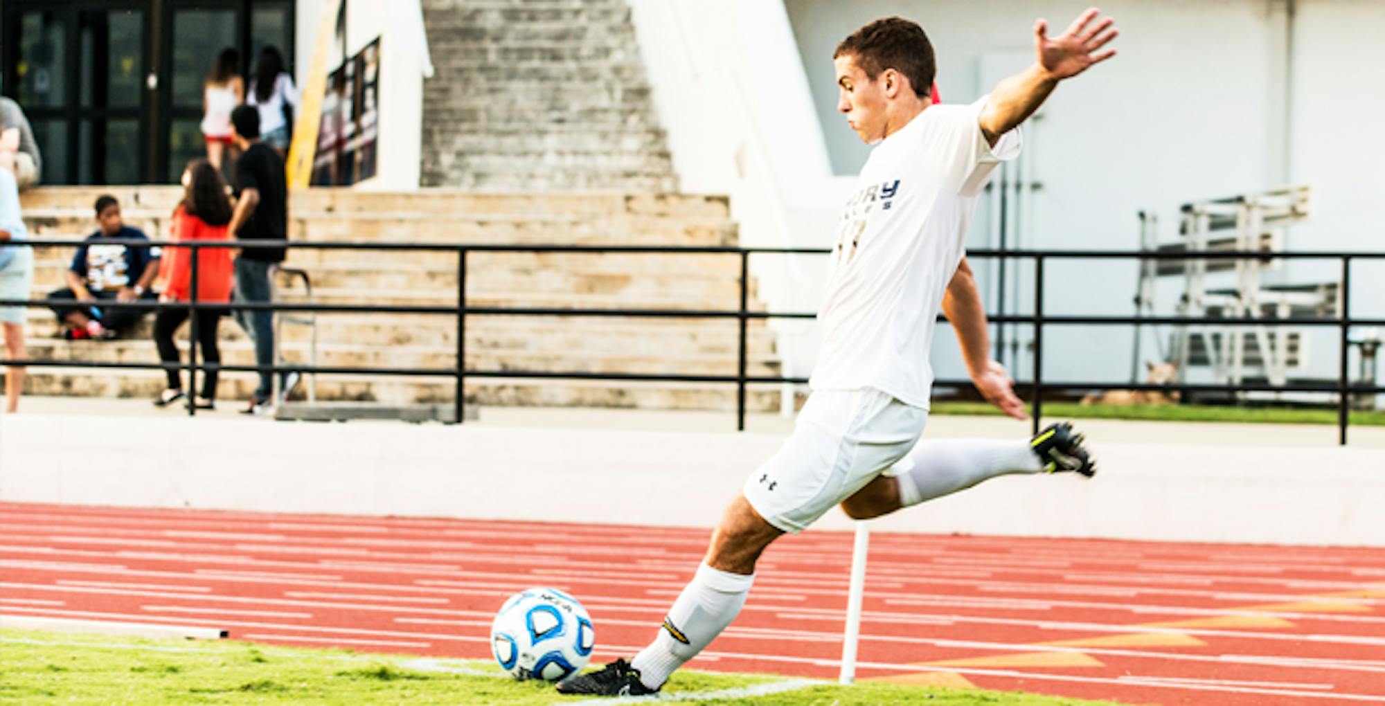 Photo by Steve Shan/Staff. Sophomore forward Jason Andrejchak reaches back before a powerful kick.  He had one shot on goal against Covenant and an assist that led to junior forward Sebastian Hardington's game-winning goal.  The Eagles remain undefeated after five games, with a 4-0-1 record.