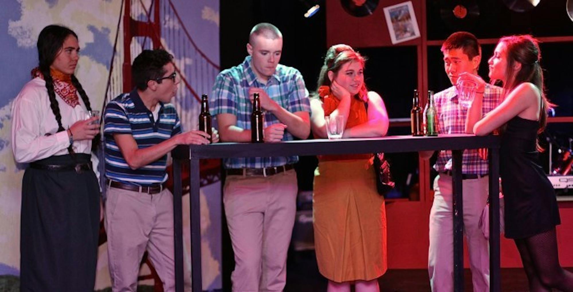 College junior Tyler Moon (center left) and College sophomore Victoria Hood (center right) attend the  titular event in Ad Hoc's production of Dogfight. The show runs through Nov. 22. Photo by Jason Oh/Staff.