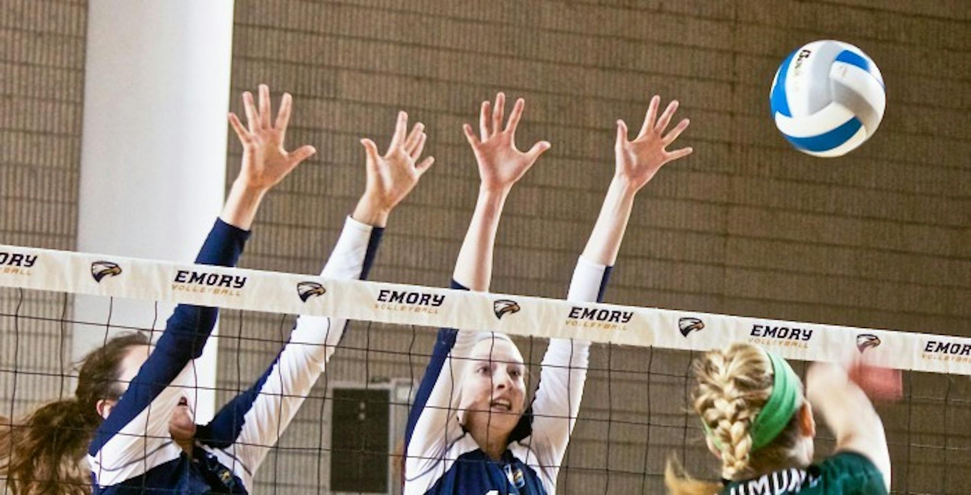 Sophomore right side hitter Sarah Maher (Left) and senior middle hitter Cat McGrath (Right) go up for the block. Maher, McGrath and the Eagles shut down Piedmont College (Ga.) 3-0 on Wednesday to bring their record to 28-3 on the season. | Photo By Jason Oh/Staff