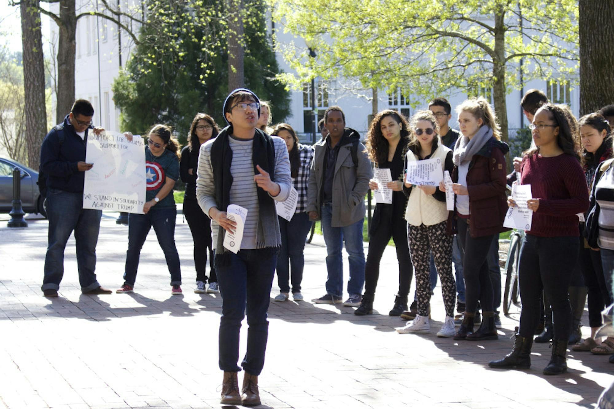 College sophomore Jonathan Peraza leads chants outside the Emory Administration Building. / Julia Munslow, Executive Editor