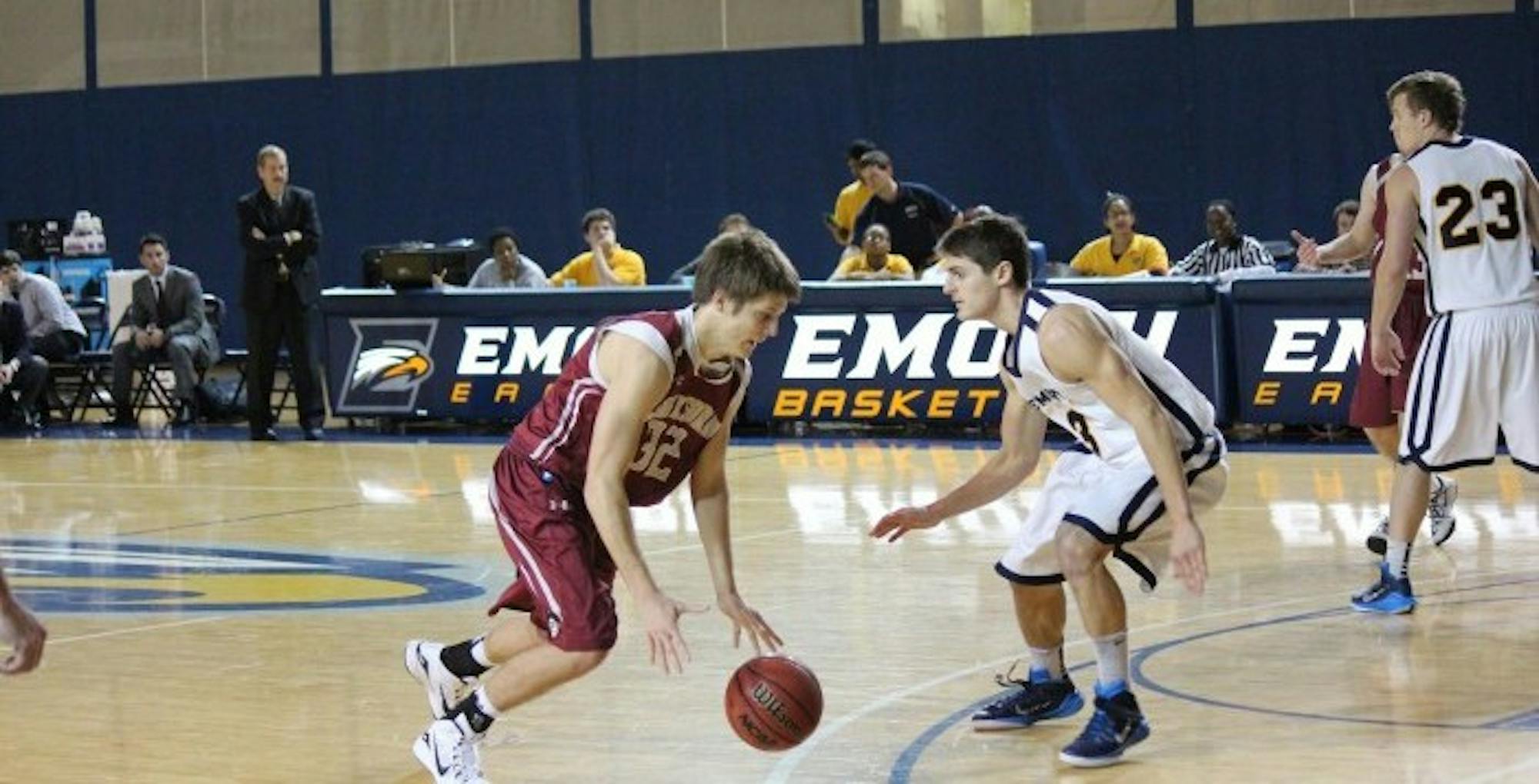 Senior Michael Florin defends against Guilford College (N.C.). Florin would go on to score 21 points, including the game-winning shot with four-tenths of a second left in the game. Photo  by Mark Spicer/Staff.