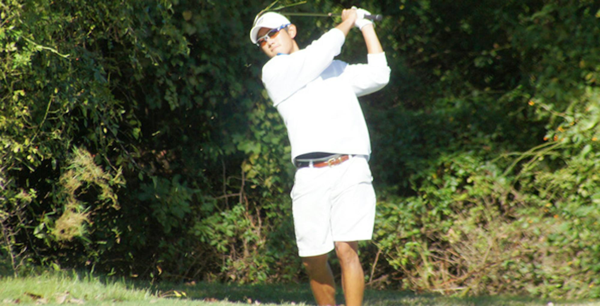 Courtesy of Emory Athletics Senior Johnathan Chen watches his shot from the backswing. Chen, who said he was distracted from golf at the start of the season, decided that he will play professionally after graduation. Two weeks ago, he finished the Emory Invitational with a score of 69.