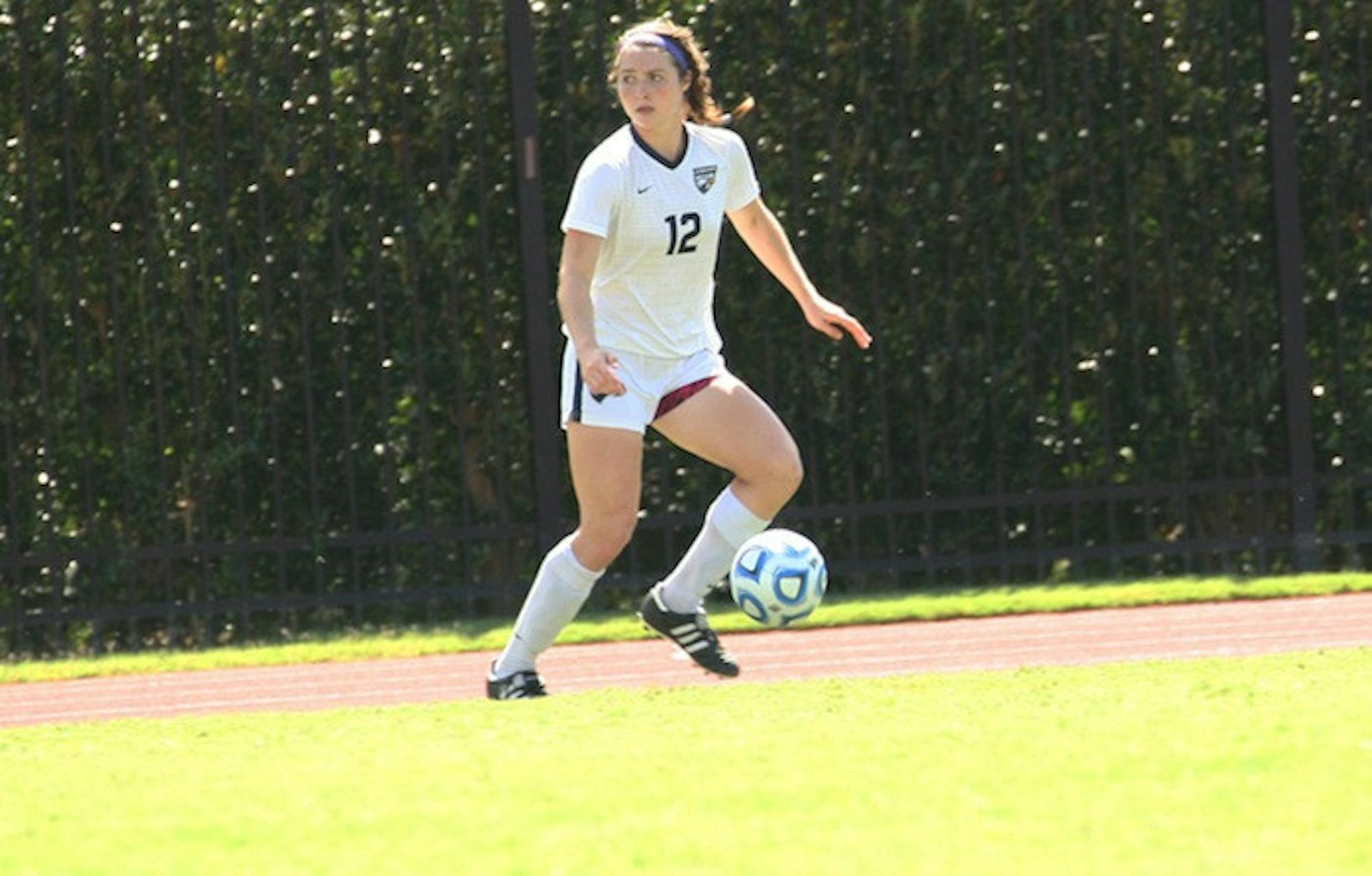 Sophomore defender Hannah Meyer dribbles the ball. Although Meyer and the Eagles are 7-1-3 overall, their loss to Chicago last Sunday brought their conference record to 0-1-1. / Photo courtesy of Emory Athletics