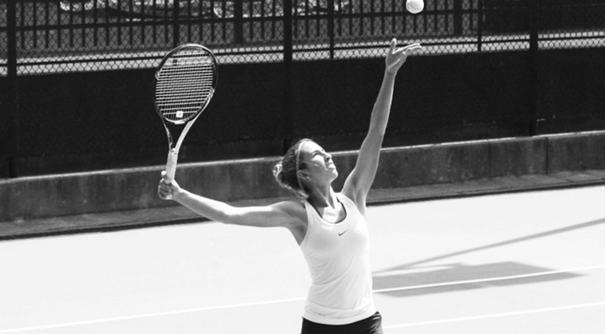 Junior Beatrice Rosen tosses the ball before a serve. Last season, she earned a spot on the all-University Athletic Association (UAA) First Team. | Courtesy of Emory Athletics