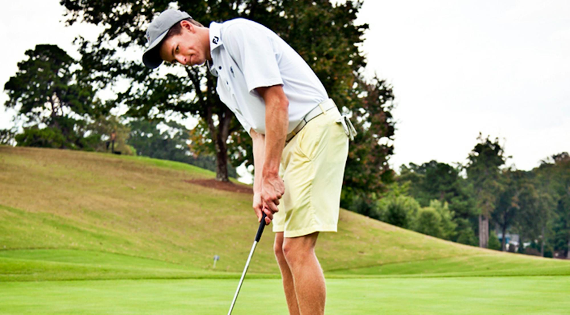 Freshman Keenan Hickton carefully putts at the ball. Hickton and the Eagles competed at the Wolfpack Spring Open this past weekend, and placed 10th out of 11 teams.  | Courtesy of Emory Athletics