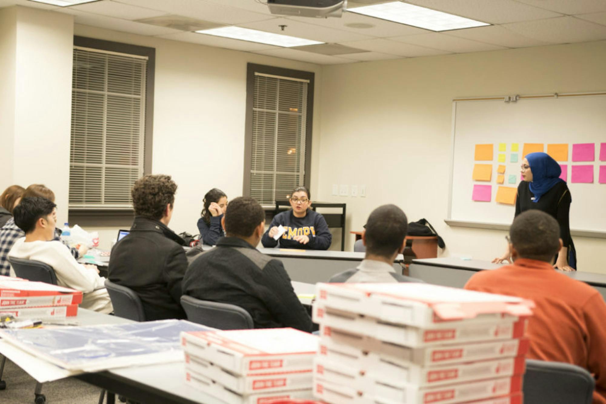 Sheba Ehteshami, co-organizer of the Atlanta March, talks with Emory community members about her motivation for and experience with creating a demonstration for women's rights. | Ruth Reyes, Photo Editor