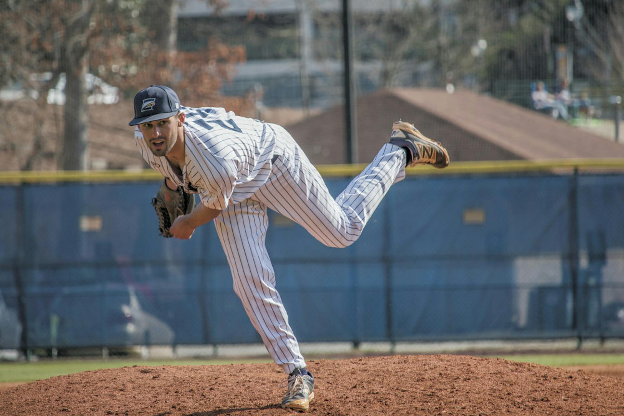 Senior pitcher Luke Emmet pitches in Sunday's game against Washington and Lee (Va.). Emory went on to win 13-0. Photo courtesy Ruth Reyes/Photo Editor.