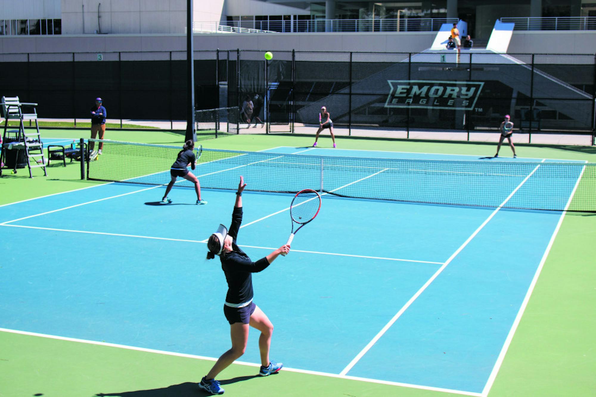 Junior Bridget Harding serves alongside doubles teammate Katarina Su in the Eagles' home match against Sewanee: The University of the South. Jillian Alsberry/Contributing