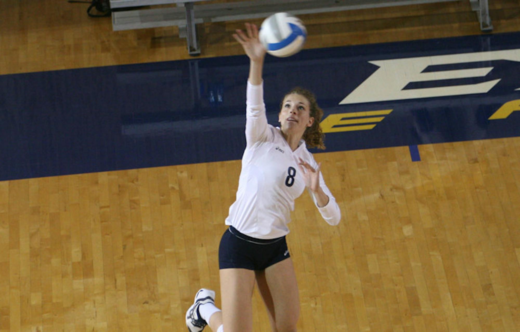 Senior outside hitter Leah Jacobs leaps for the ball. Jacobs was named a member of the Capital One Academic All-District Team for her scholastic and athletic excellence. | Courtesy of Emory Athletics.