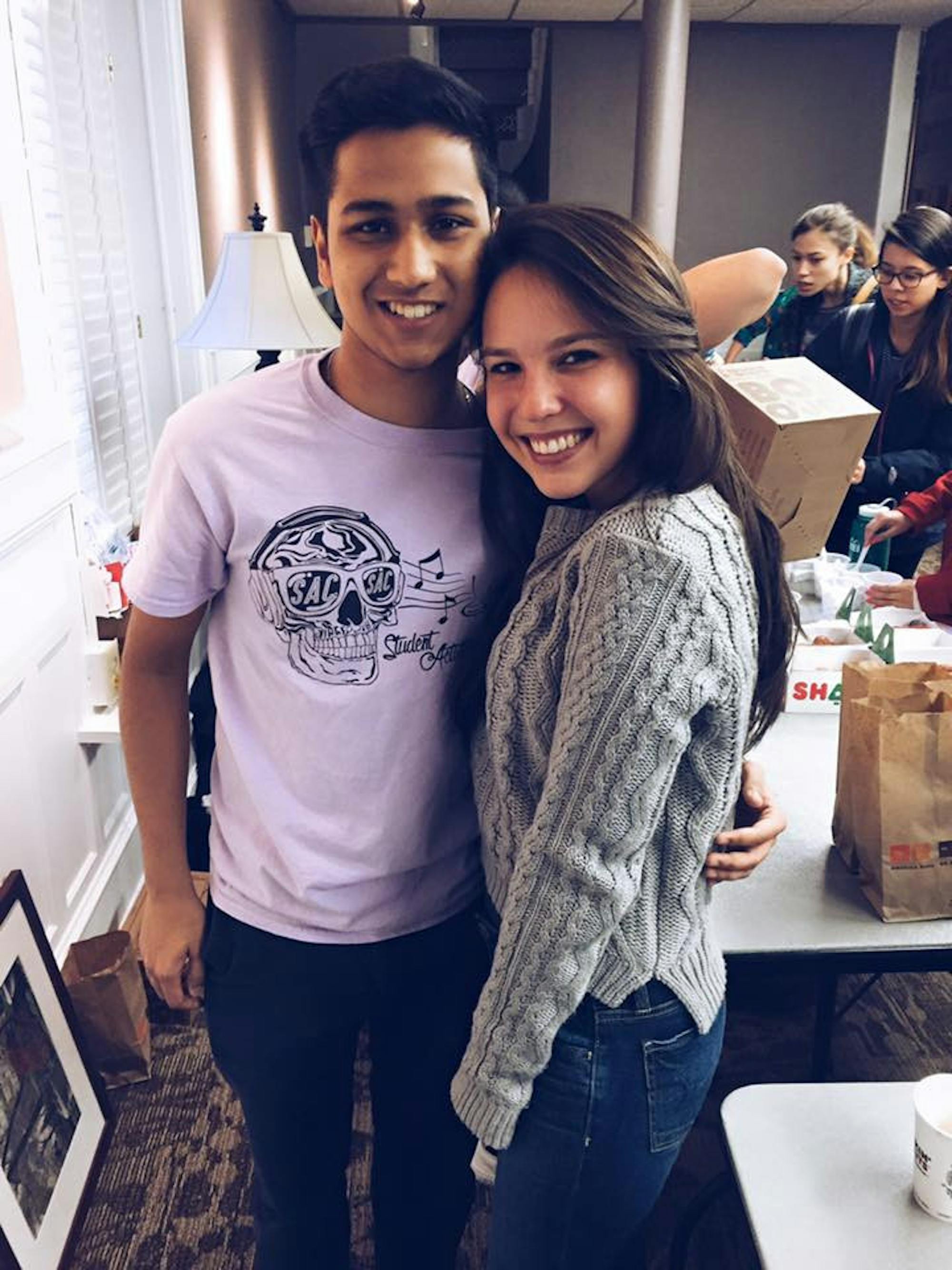 Faraaz Hossain (left) and Camilla Gallin (right) smile and pose for a photo at a Fun Before Finals SAC event in Candler Hall. / Courtesy of Camilla Gallin