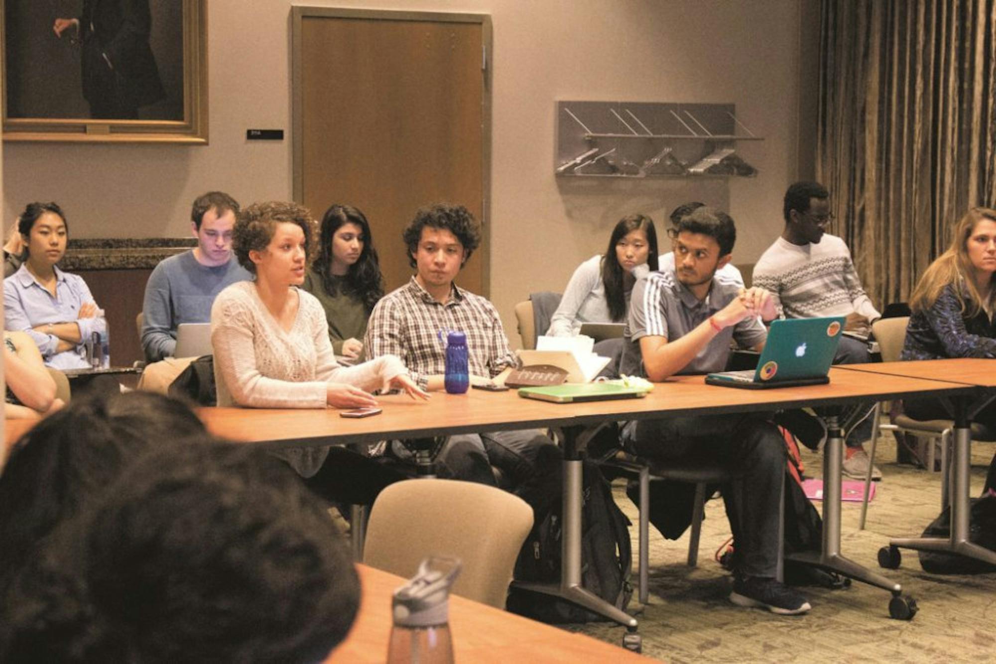 Oxford College sophomore and Oxford-Emory Liaison Alexa Cleveland (LEFT) discusses her amendment to the restructure bill. / Michelle Lou, News Editor