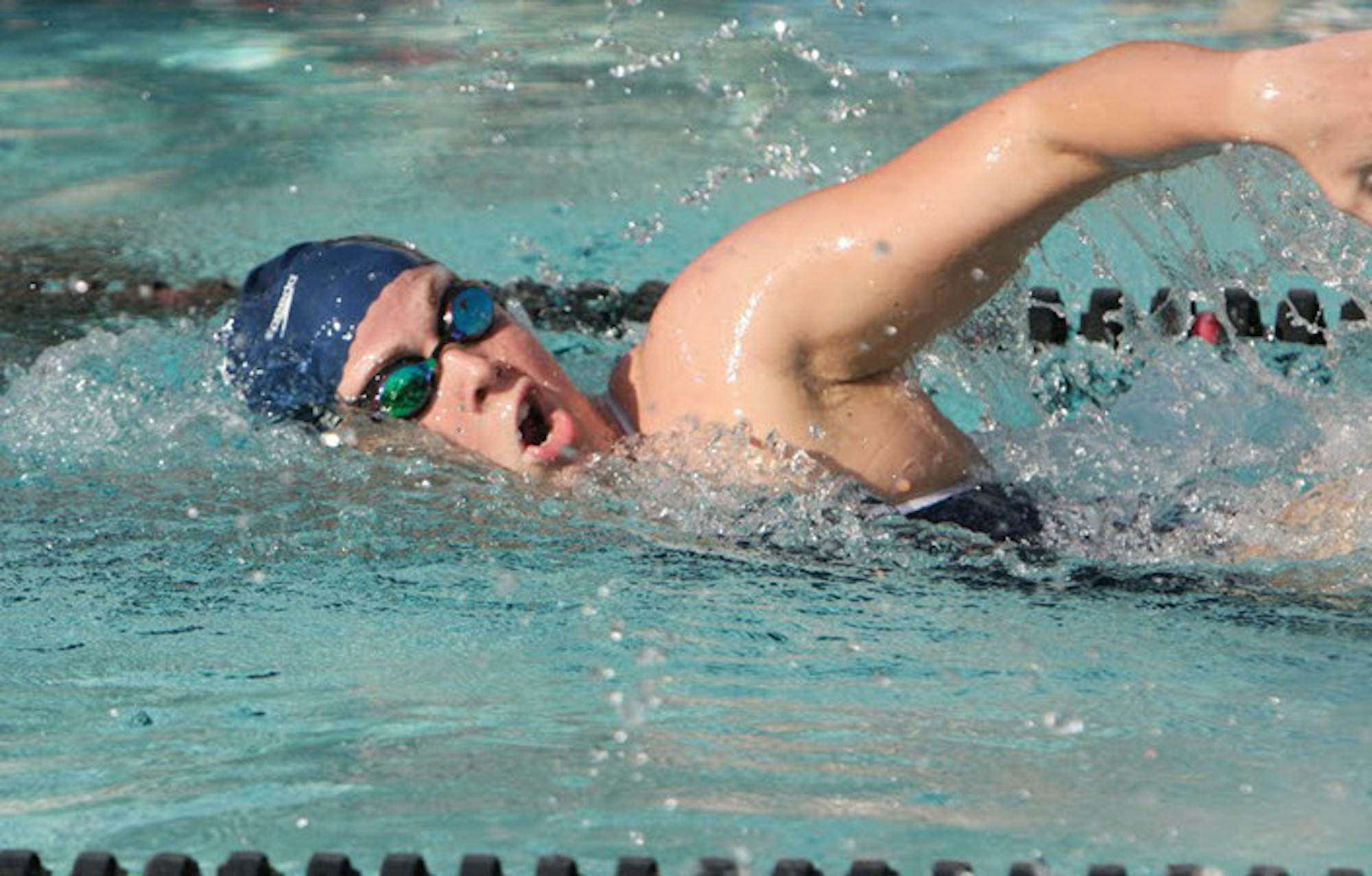 An Eagle swims in a freestyle race. The Emory women split up to travel to top-ranked Division I University of Georgia and Sewanee: University of the South (Tenn.) last Saturday. After a week of rest, the team will host the University Athletic Association (UAA) Championships. / Courtesy of Emory Athletics