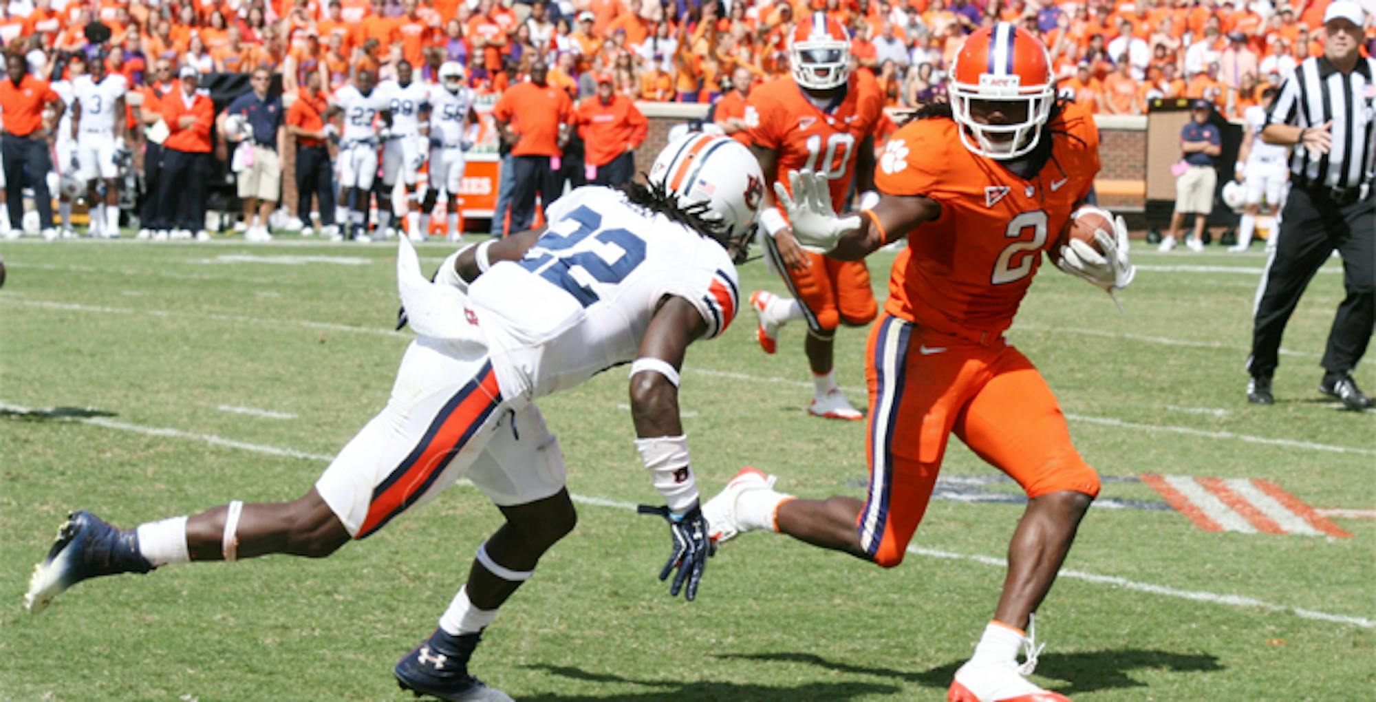 Courtesy of Flickr/Parker Anderson Auburn University defensive back Khari Harding lunges for Clemson University cornerback Mackensie Alexander in Clemson's Memorial Stadium.