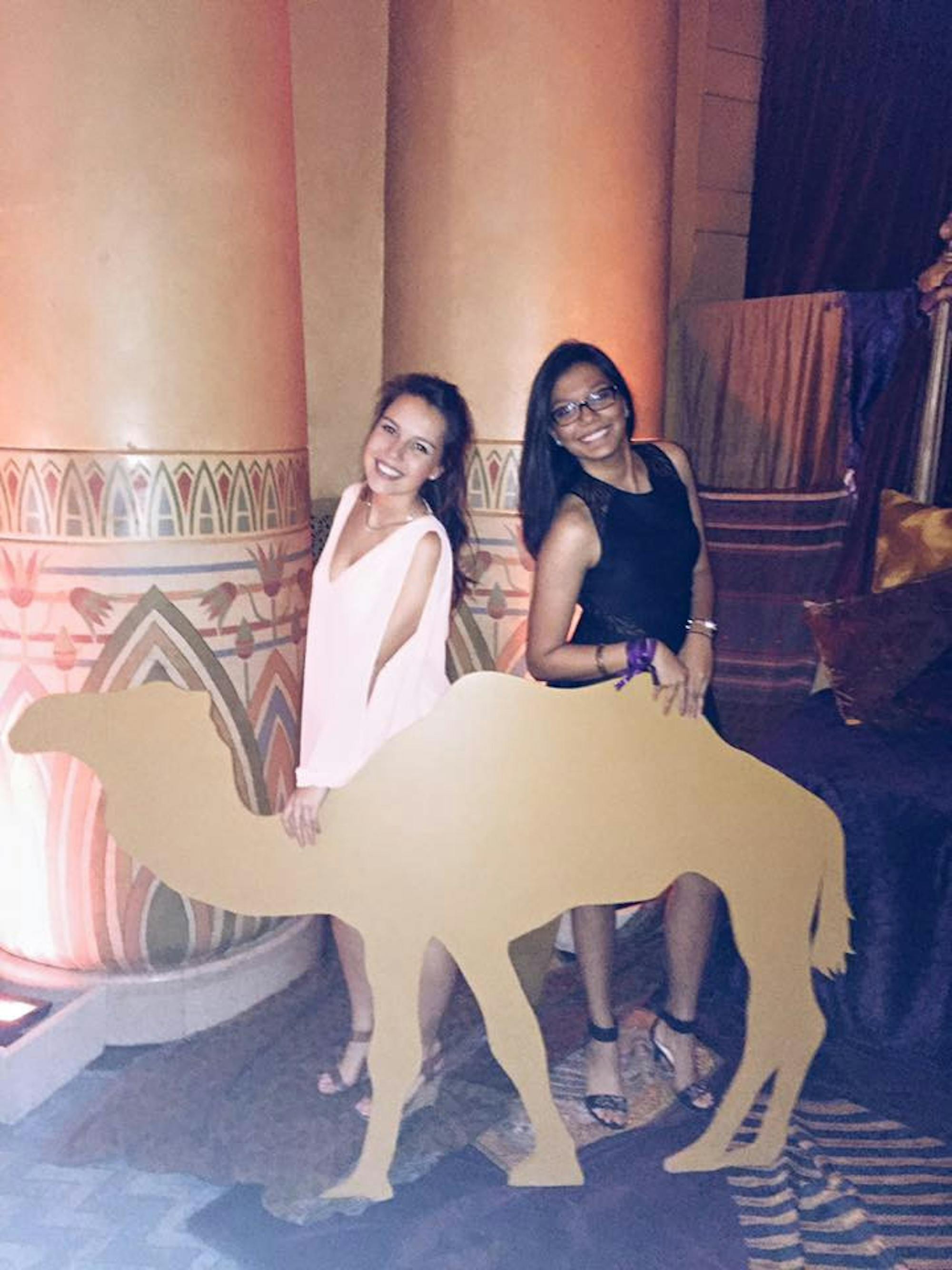 Abinta Kabir (right) and Camilla Gallin (left) pose with a cutout of a camel for a photo at Oxford’s 2015 Fall Formal at the Fox Theatre, themed “Desert Oasis.” / Courtesy of Camilla Gallin