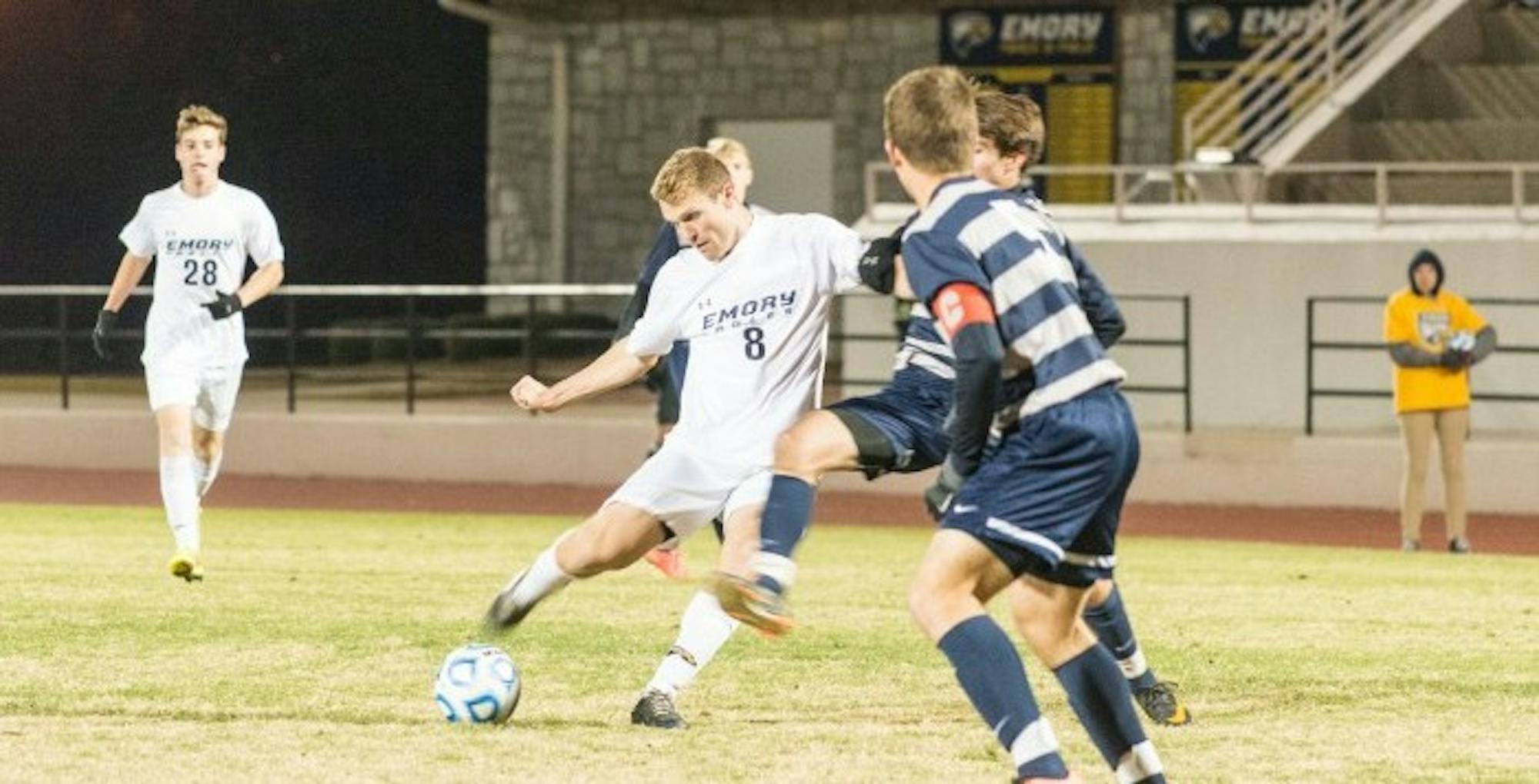 Junior forward Sebastian Hardington kicks the ball past a Berry College (Ga.) player. Hardington scored the lone goal for the Eagles against Berry last Friday. Berry defeated the Eagles, bringing their season to an end. Photo by Steve Shan/Asst. Photo Editor.