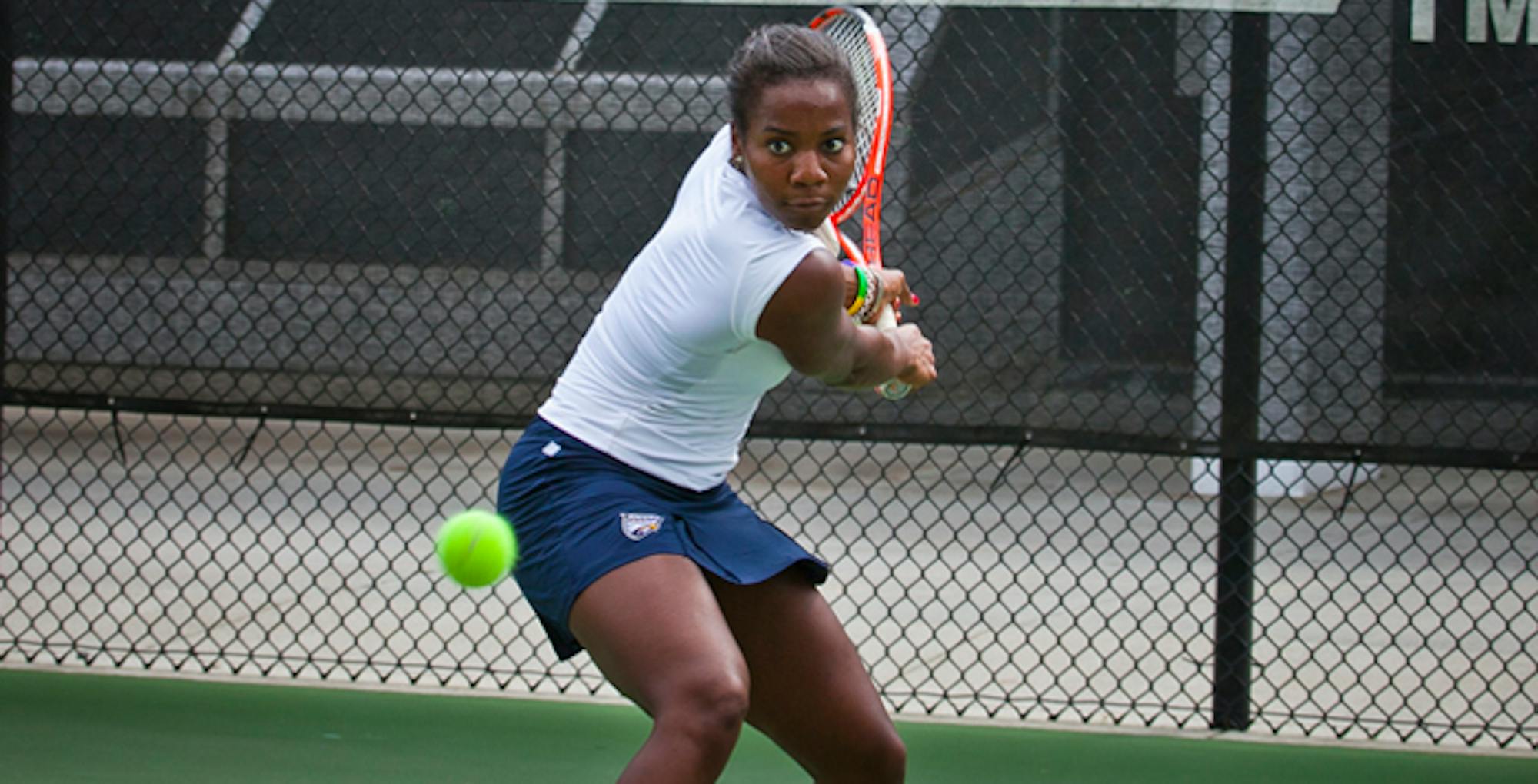 Courtesy of Emory Athletics Senior Gabrielle Clark fiercely returns a shot. Clark and the Eagles did not lose a set in their singles competitions in their outing against Brenau University last Tuesday.