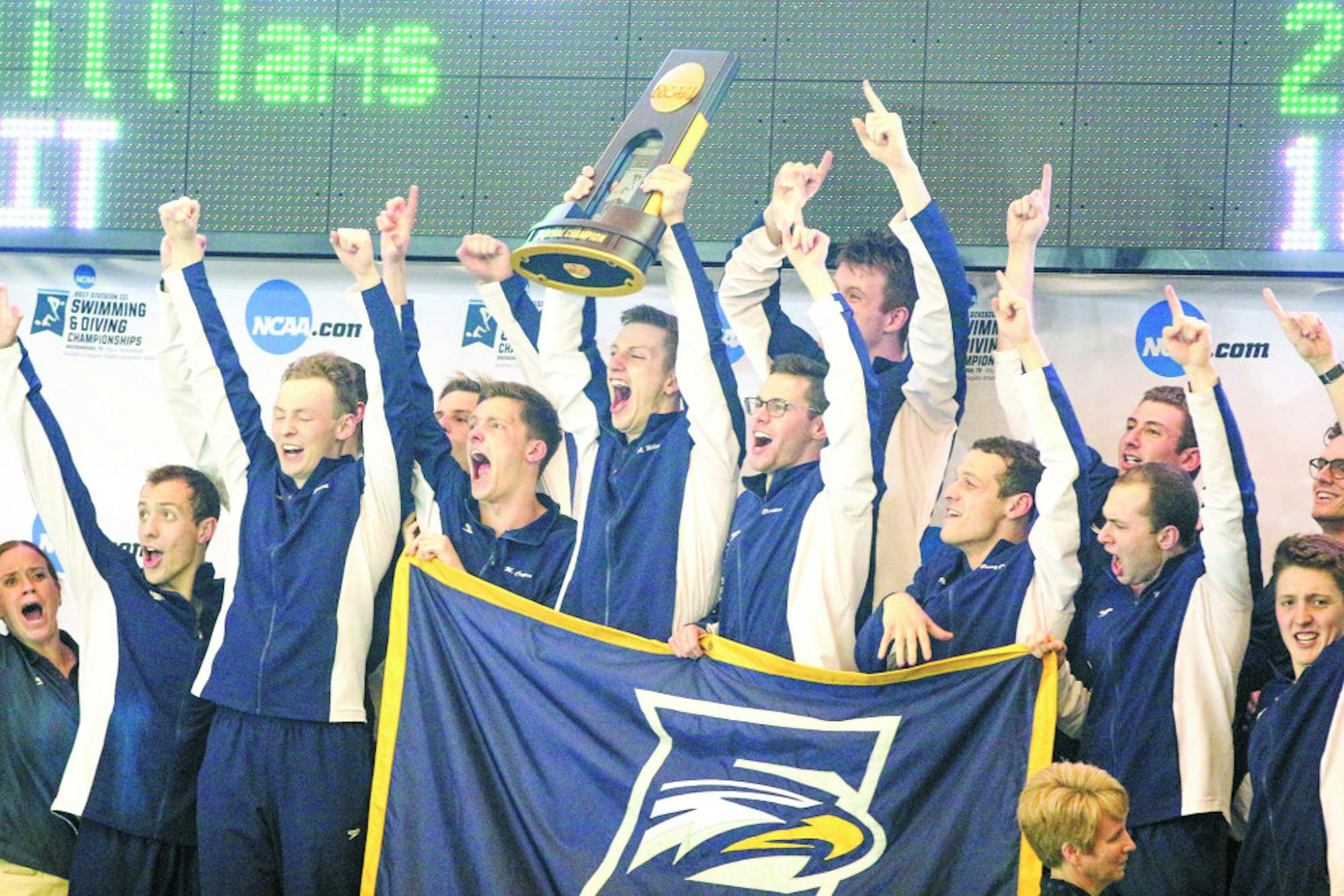 The Emory men's swimming and diving team celebrates their first NCAA D-III title in school history. Photo courtesy Paul Smith.