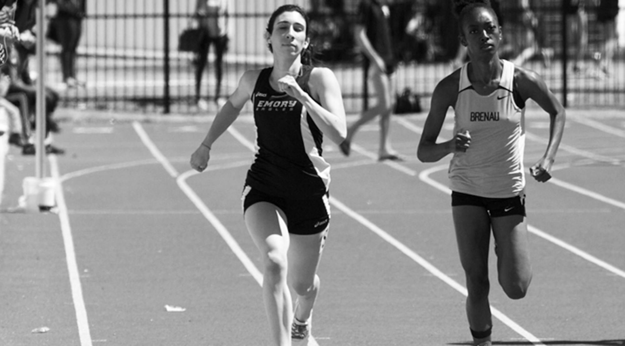 Freshman Erica Goldman runs next to her opponent. Goldman recorded a career-best time of 57.82 seconds in the 400-meter dash this past weekend. | Courtesy of Emory Athletics