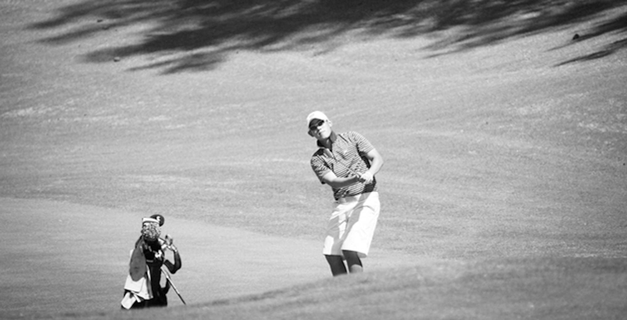 Courtesy of Emory Athletics Senior Johnathan Chen chips onto the green. Chen led the Eagles last weekend with a score of 149 at the Navy Spring Invitational. The Eagles finished in tenth in the tournament.