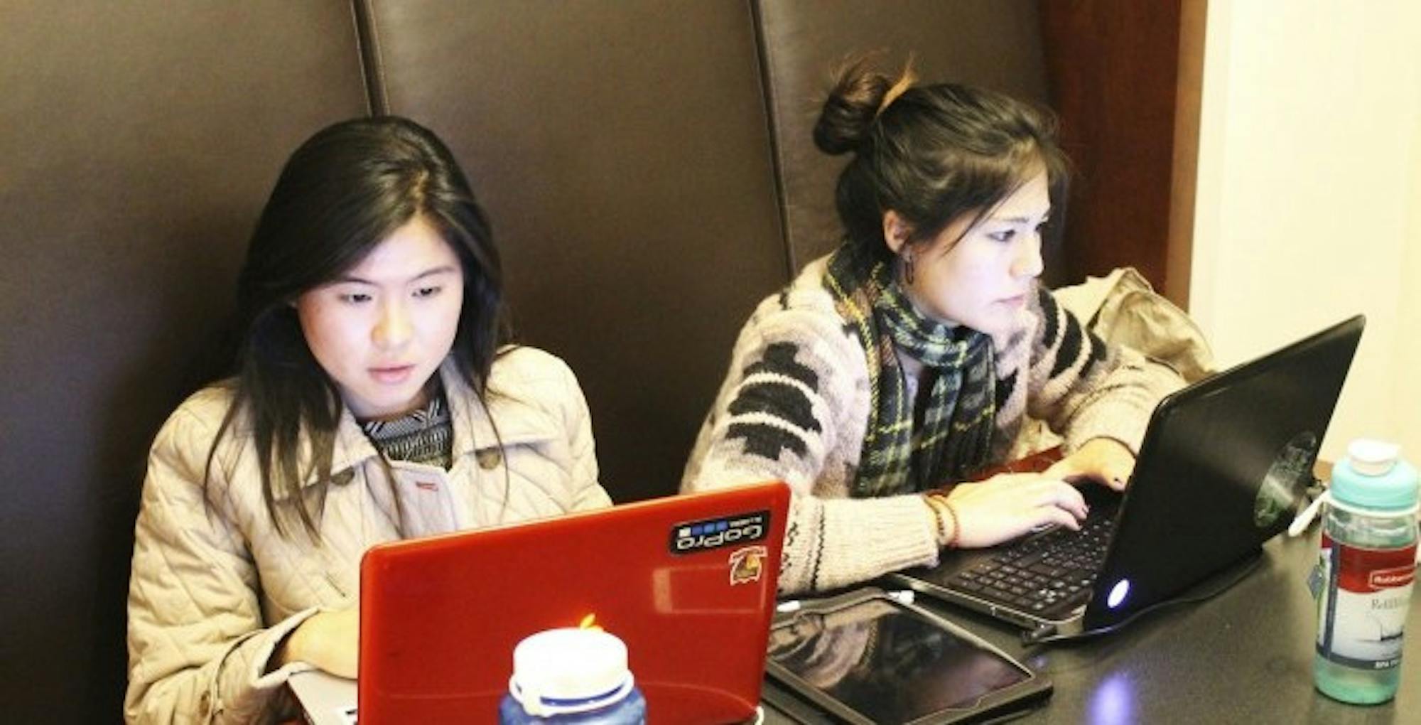 Seniors Yuma Ikei and Charmaine Pek were two of many students who gathered in the Goizueta Business School to work on their propositions during the second annual hackATL.