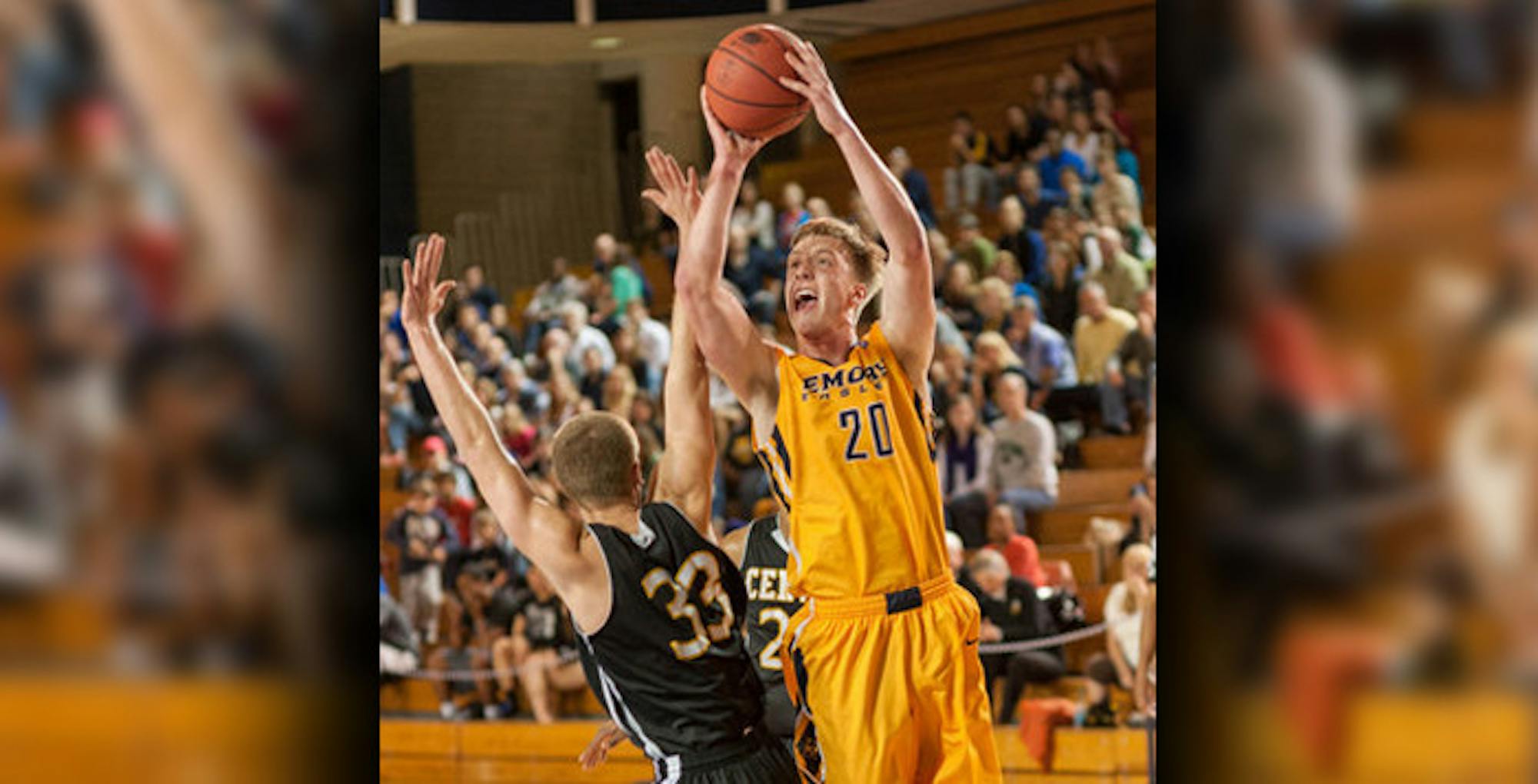 Senior captain and forward Alex Foster jumps to take a shot over an opposing player. | Photo Courtesy of Emory Athletics.