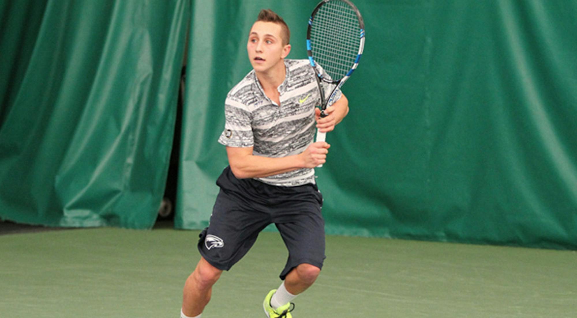 Courtesy of Emory Athletics Junior Rafe Mosetick runs to hit the ball. Mosetick was named the University Athletic Association (UAA) Athlete of the Week this past week.