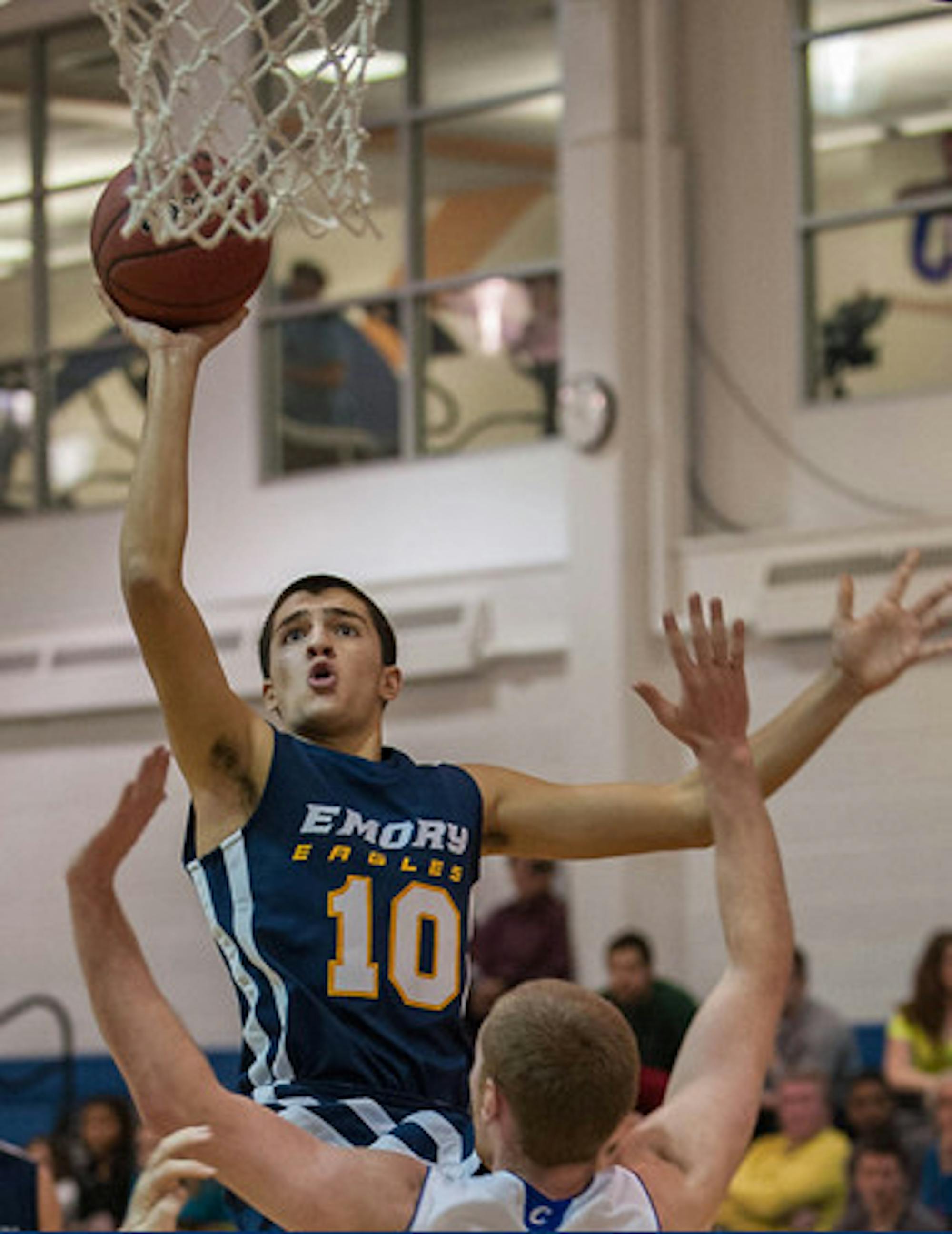 Junior guard Davis Rao leaps for the basket. Rao and the Eagles defeated Brandeis University (Mass.), but fell to New York University last weekend. | Courtesy of Emory Athletics.