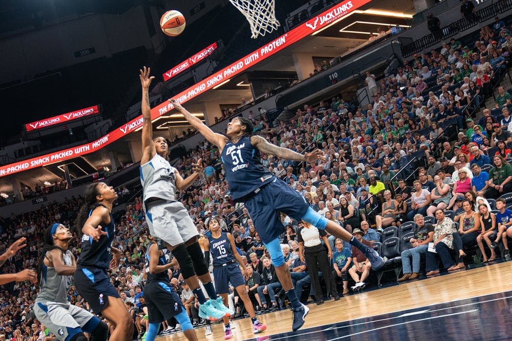 Rebekkah_Brunson_shoots_as_Jessica_Breland_attempts_to_block_the_shot_in_the_Minnesota_Lynx_vs_Atlanta_Dream_game
