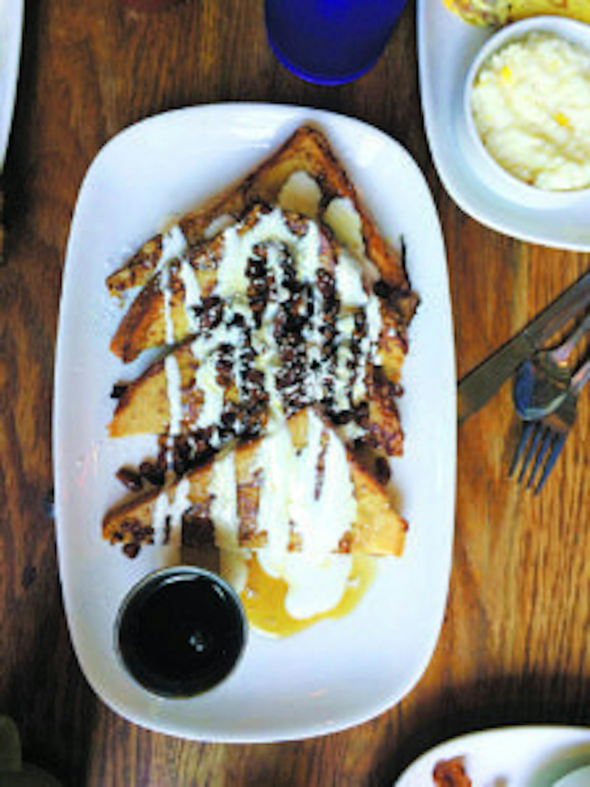 The signature french toast served at Inman Park's Folk Art comes in four whopping slices topped with pecans, powdered sugar, icing, syrup, and additional maple syrup on the side. The breakfast treat will stun any customer with its decadence.