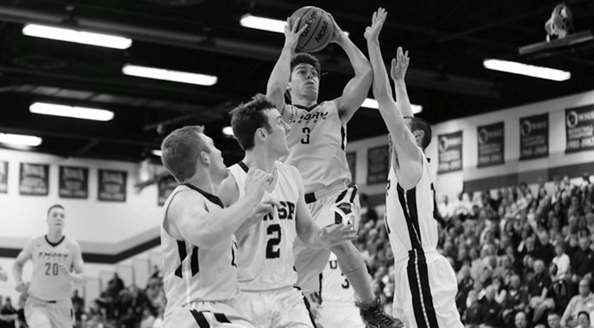 Senior captain Mike Florin goes for a basket against the University of Wisonsin-Stevens Point. Florin and the Eagles ended their season with a 73-53 loss. | Courtesy of Emory Athletics