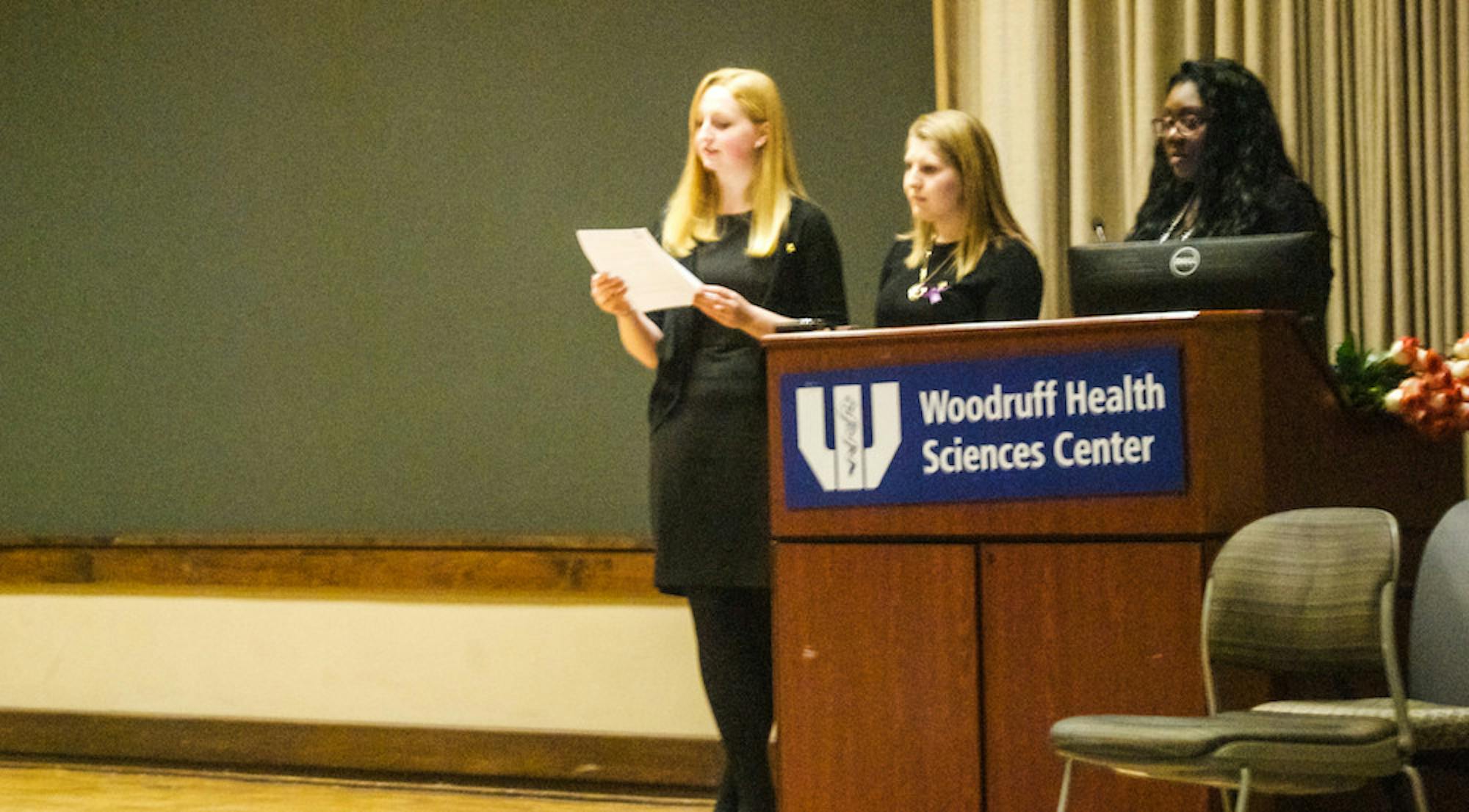 Members of the Delta Phi Epsilon sorority introduce the speaker at ANAD Week, which is aimed at bringing awareness to eating disorders. | Andrew Ie, Staff