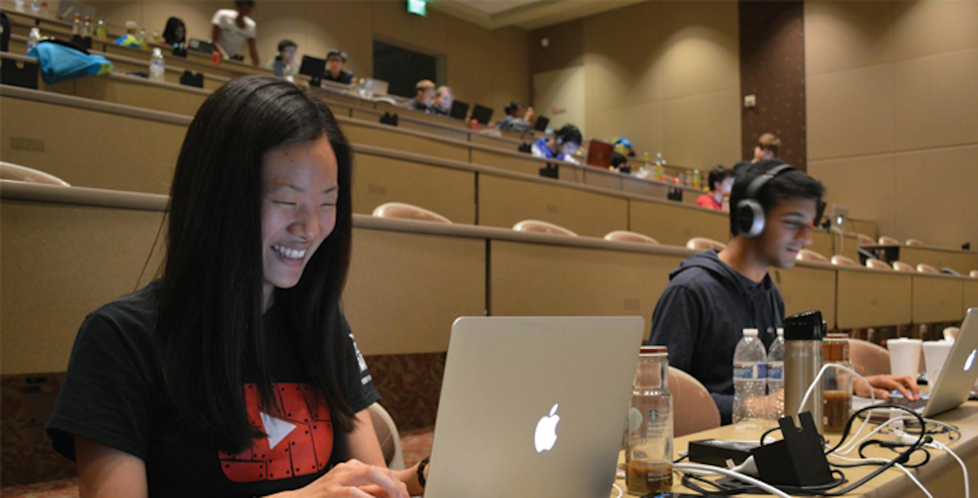 Photo by Jenna Kingsley College senior Christal Wang (left) and Georgia Institute of Technology sophomore Kush Patel (right) worked on   their app, PhotoSinc, Saturday night at the Emory Hackathon.