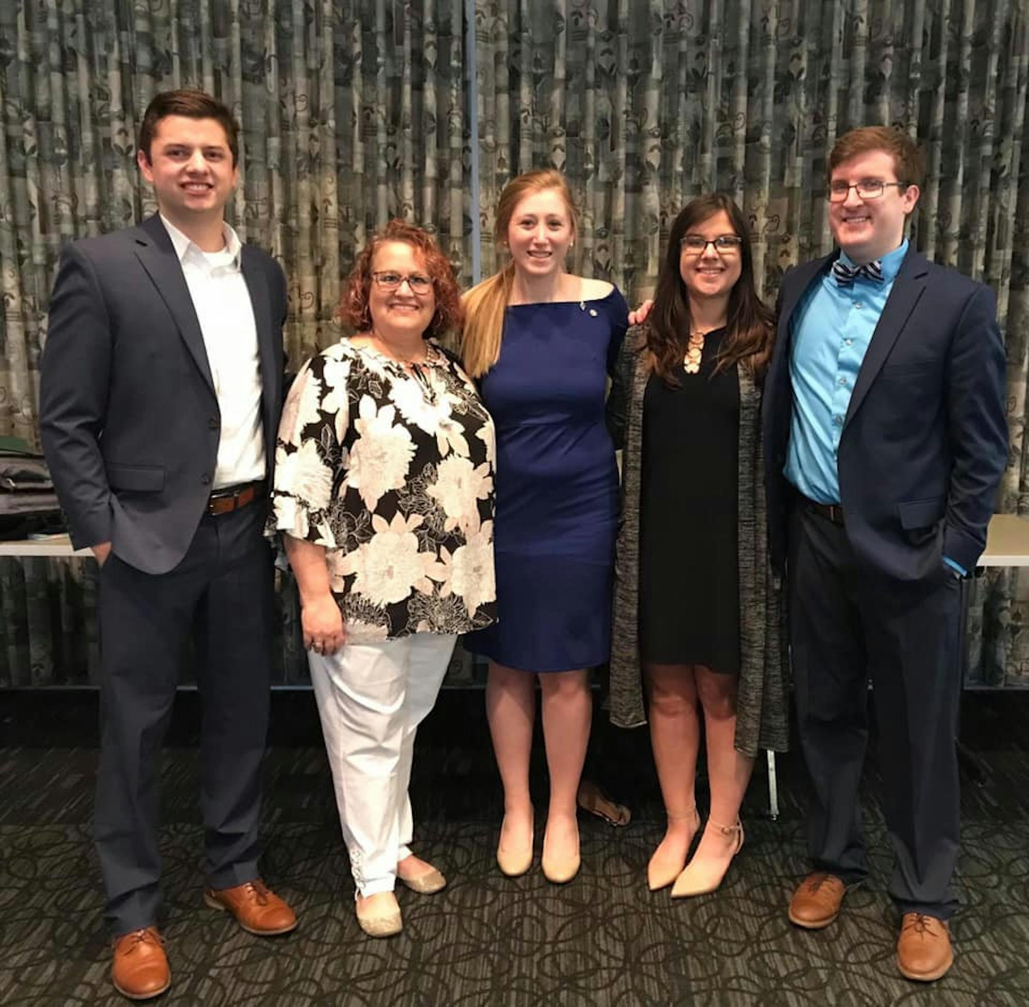 Gina Keucher, Greek Life Advisor, with three of our past FSC Presidents, as well as our next FSC President. / Photo provided by Sarah Christy