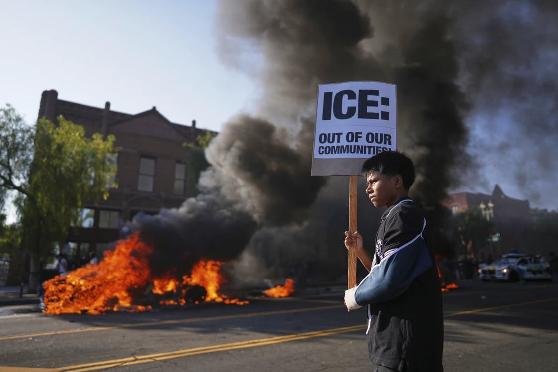 LA protests. Protestor with anti-ICE sign.png