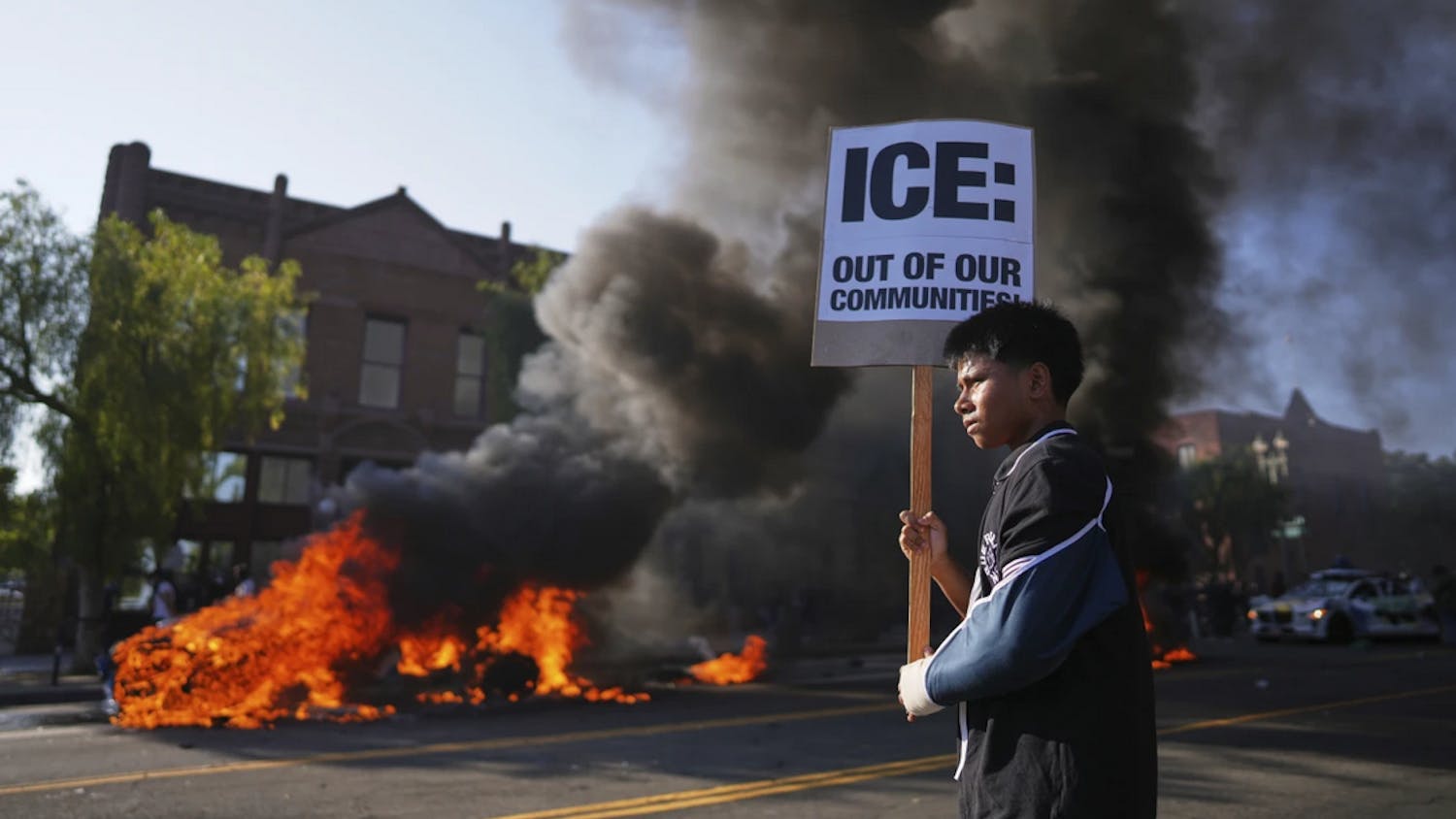 LA protests. Protestor with anti-ICE sign.png